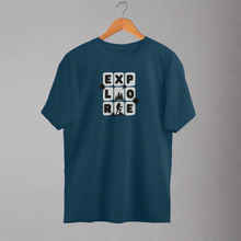 Load image into Gallery viewer, A navy blue oversized t-shirt with the text 'EXPLORE' printed on the front, displayed on a hanger.