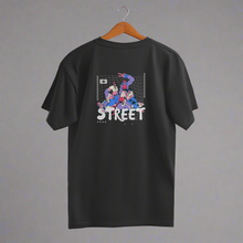 Load image into Gallery viewer, Black oversized t-shirt with graphic print on the back hanging on a hanger, displayed on a white background.