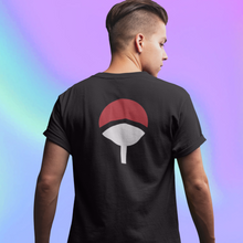 Load image into Gallery viewer, A person wearing a black t-shirt with a red and white Uchiha Clan logo on the front.
