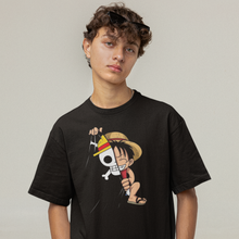 Load image into Gallery viewer, A person wearing a black unisex t-shirt featuring a graphic design of the character Luffy from the anime One Piece.
